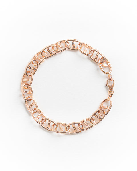 Rose gold bracelet on a white background