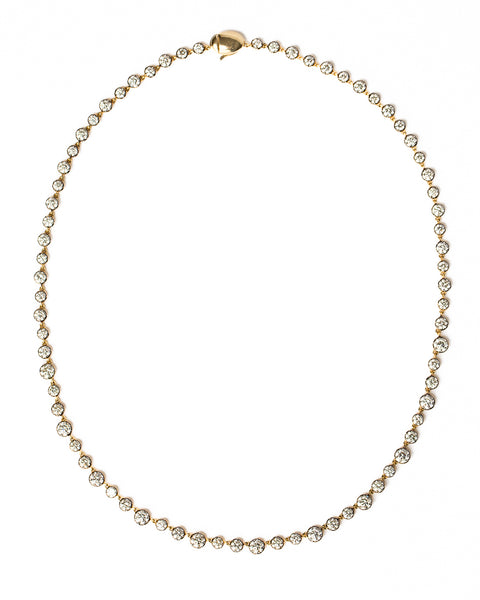 diamond and gold necklace on white background