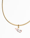 gold chain and a charm on white background