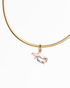 Gold necklace with a pink gemstone pendant on a white background