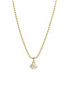 Gold necklace with a small pendant on a white background