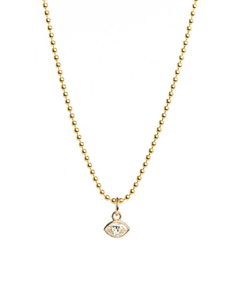 Gold necklace with a small pendant on a white background