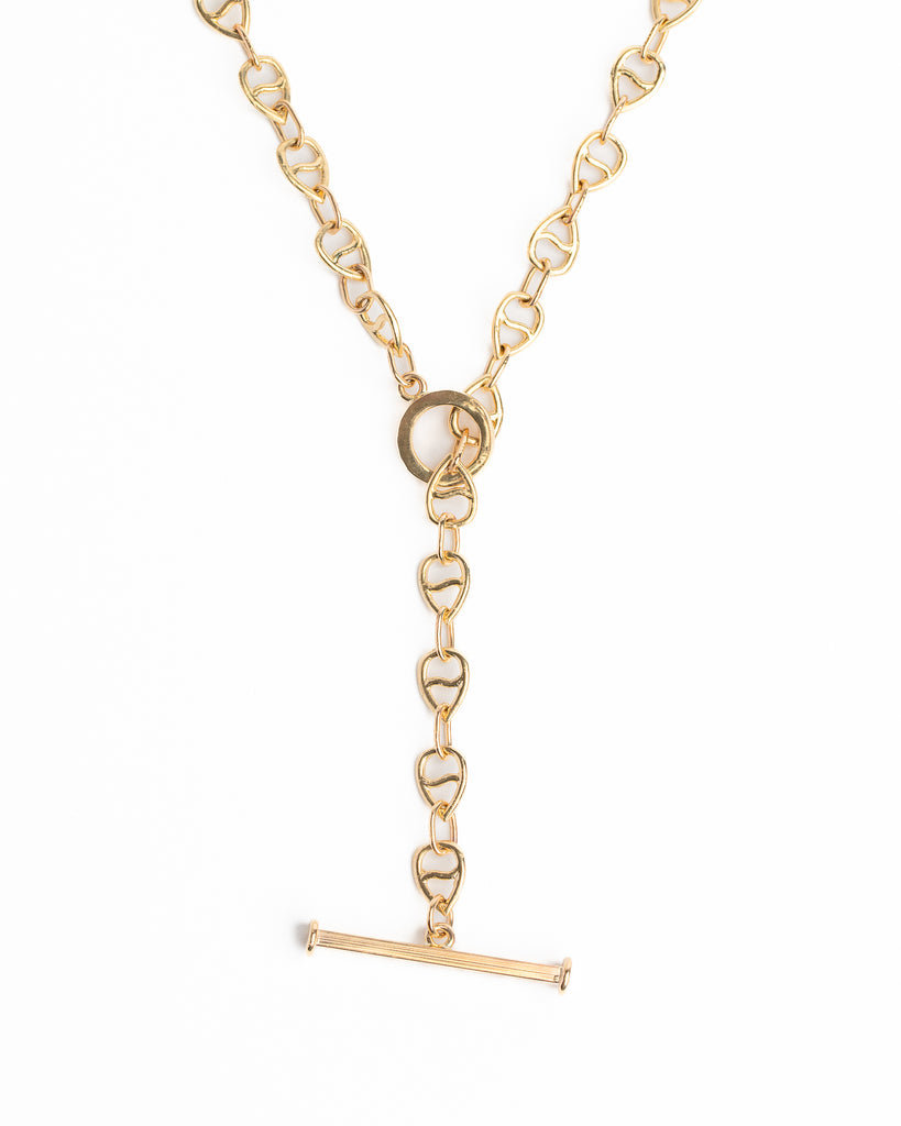 Gold necklace with heart-shaped links on a white background