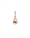 Teardrop-shaped pendant with rose gold frame on a white background
