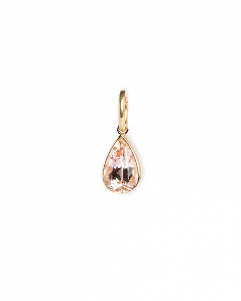Teardrop-shaped pendant with rose gold frame on a white background