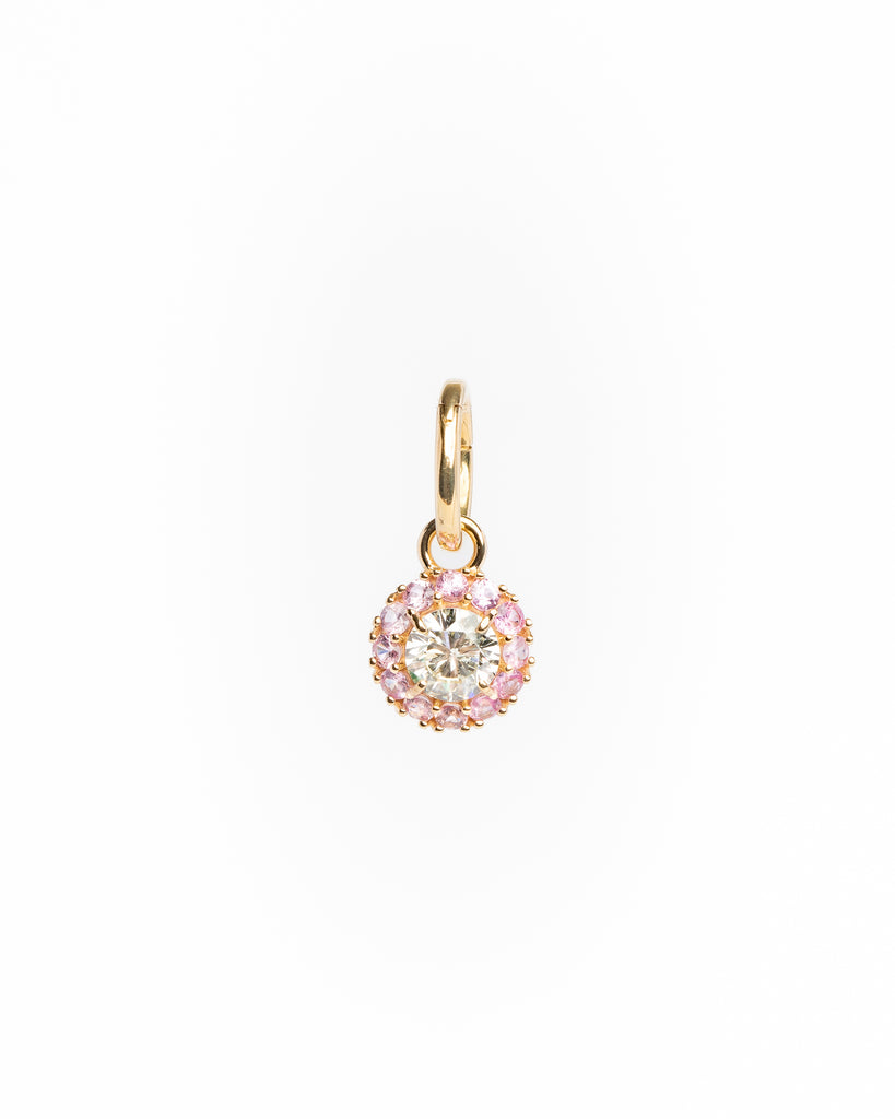 Gold pendant with a central diamond and pink gemstones on a white background