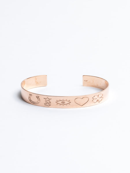Genevieve Lau jewelry.  Gold cuff bracelet with engraving. Shown in rose gold.  Lucky thin cuff. 