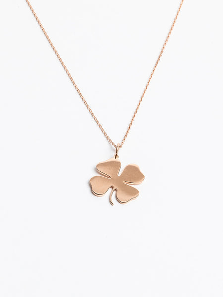 Genevieve Lau jewelry. Gold clover pendant on gold chain.  Lukcy Charms pendant.Shown in yellow gold. 