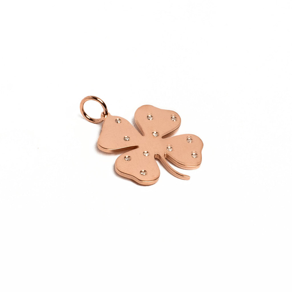 Lucky Charm with Bling. Rose Gold four leaf clover charm with scattered diamonds. For every clover sold, one is donated toa child with Cancer. Purpose Driven Elegance.